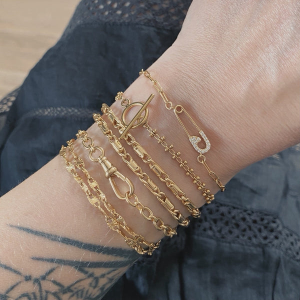 Pin de pulsera
